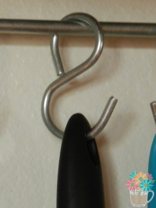 For hanging the utensils, we purchased some S hooks then the Mister put his muscles to action and, along with a pair of pliers, bent one end so it was a loop. If you're doing this, be sure to bring along your thickest utensil with the hole that's furthest from the tip of the handle to try different S hooks to see which one fits (first set of S hooks we got were too small).
