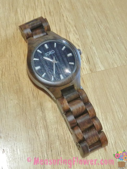 This watch is gorgeous. It has a beautiful, black wood grain face, a scratch-proof glass face cover, and a wooden wrist band.