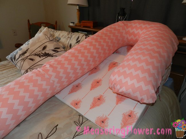 Once the base and bla pillow are connected, the body pillow is rested on top.