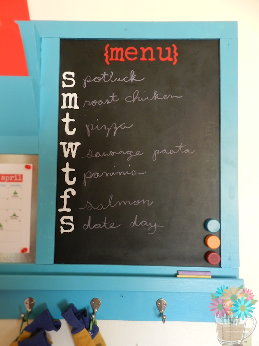 One of my favorite elements of the command center is the chalkboard menu. We had this chalkboard that we had used for a menu before, so, when we made this command center, we removed the frame and glued to the back of the command center. The "{menu}" and weekday lettering I made with vinyl using my Silhouette machine.